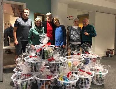 Volunteers put together holiday baskets for the HomeStart shelter